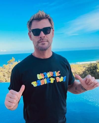 Chris Hemsworth Exudes Effortless Cool In Classic Black Tee Pose