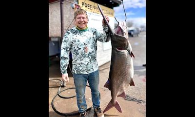 Angler retrieves critical implement from campsite before record catch