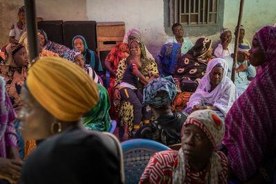 In Guinea's capital, a heartbroken family brings their son's body home