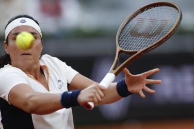 French Open: Rublev Upset, Swiatek Advances, Rain Delays Play