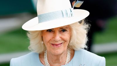 Queen Camilla oozes elegance in a pastel suit and feathered trilby for Epsom races – it's one of her best looks yet