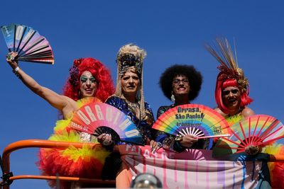 Gay pride revelers in Sao Paulo reclaim Brazil's national symbols