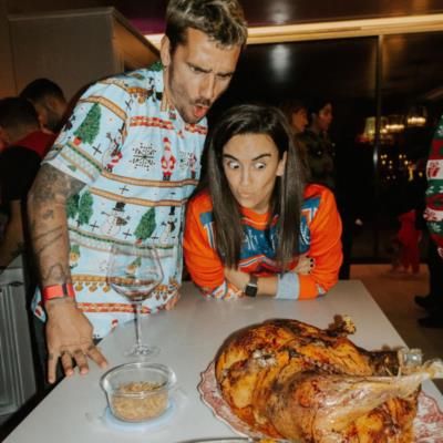 Antoine Griezmann And Partner Enjoy Playful Moment Over Dinner