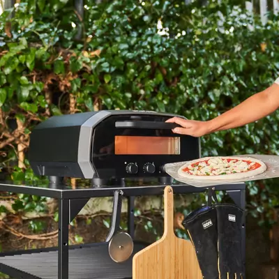 'I tried the world's first indoor and outdoor pizza oven from Ooni - it's a gamechanger if you don't have a garden'