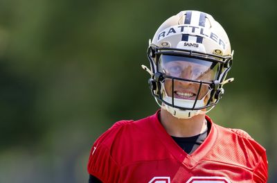 Spencer Rattler needs some coaching on how to paint the Saints’ logo