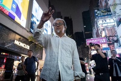 Tiananmen Square anniversary: Hong Kong police detain artist who made sign in the air