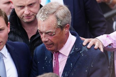 Two people arrested after milkshake thrown over Nigel Farage as he launched general election campaign
