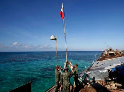 Philippines says China coast guard seized food dropped by plane for Filipino forces in disputed sea