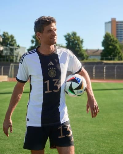 Thomas Müller Posing With A Football For Photographs