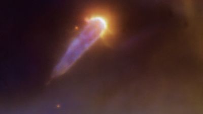 This planet-forming disk shaped like a comet is struggling to survive