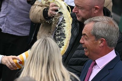 Woman charged after milkshake thrown over Nigel Farage during campaign launch