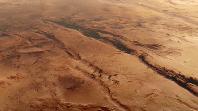Fly over the scarred canyons of Mars in this breathtaking video from European spacecraft
