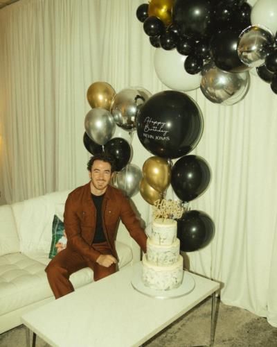 Kevin Jonas Celebrates In Stylish Brown Outfit Next To Cake