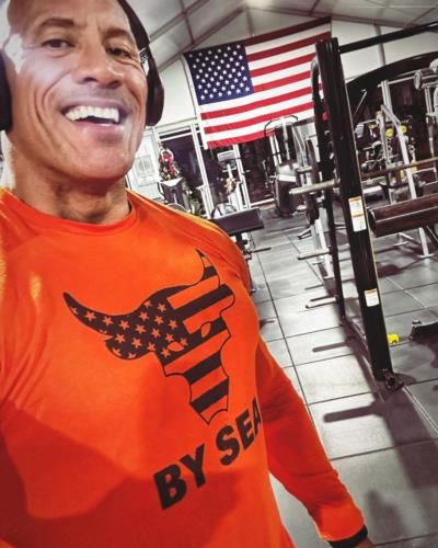 Dwayne Johnson's Inspiring Gym Selfie In Vibrant Orange Attire