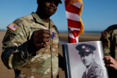 Black D-Day combat medic's long-denied medal tenderly laid on Omaha Beach where he bled, saved lives