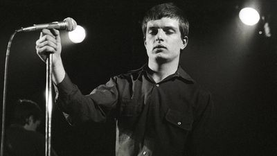 “I slid to the floor in shock. I didn’t speak, didn’t want to say a word to anyone.” The day that Joy Division learned their friend and frontman Ian Curtis had died