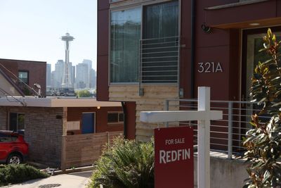 As funding remains an issue, migrants camp out in Seattle. They seek to occupy a nearby vacant motel