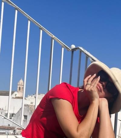 Maia Mitchell Radiates Joy In Red Top And White Hat
