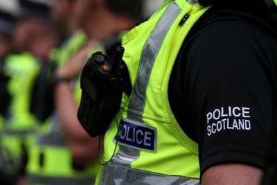 Woman dies and man arrested following a 'disturbance' at a property