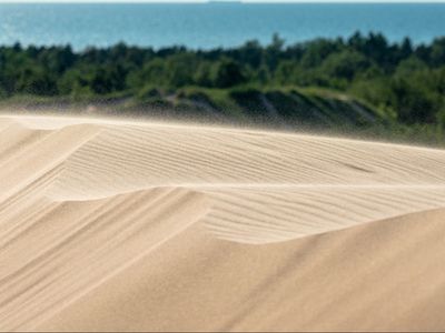 Boy, 12, is rescued by bystanders after being buried in 5ft deep hole in sand dune for 14 minutes