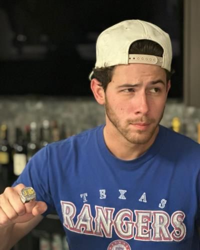 Nick Jonas Shows Off Texas Rangers Tee In Stylish Pose