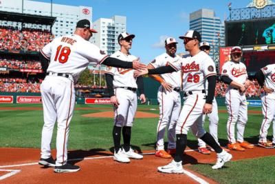 Ramón Urías And Teammates Prepare For Baseball Game On Diamond