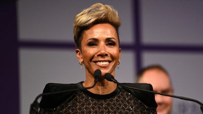 Dame Kelly Holmes stuns in menswear, showcasing the power of tailoring with striking before and after shots