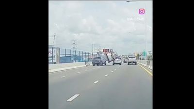 Watch This Car Try to Lane-Split and Get Sent Flying Into the Air