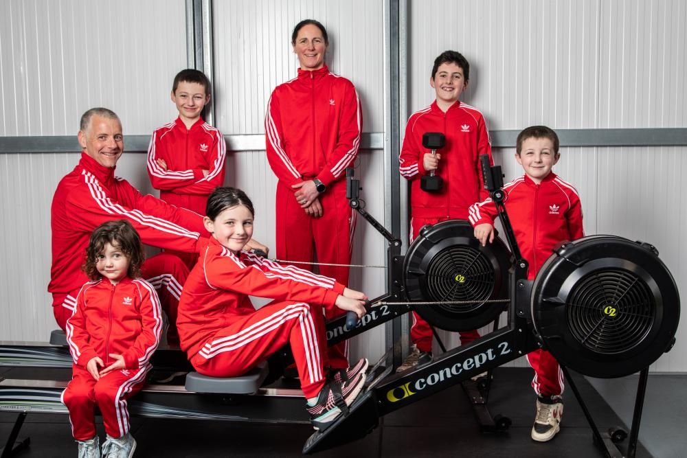 Five kids in a home gym, mother and daughter…