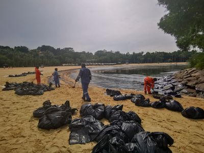 Singapore rushes to clean-up oil slick after boat hits stationary fuel supply ship