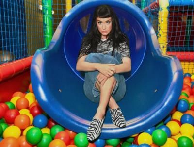 Katy Perry Embraces Playfulness In Whimsical Slide Photo