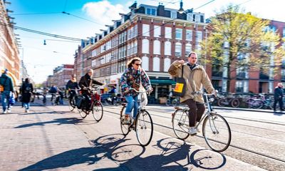 ‘The brain is very vulnerable’: Dutch cyclists urged to wear helmets as road deaths rise