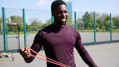 Build full-body strength and boost your metabolism with this trainer's 30-minute resistance band routine