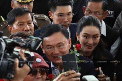 Thaksin arraigned on lese majeste case