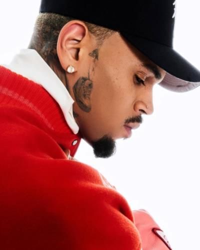 Chris Brown Flaunts Trendy Style In Red Top And Cap