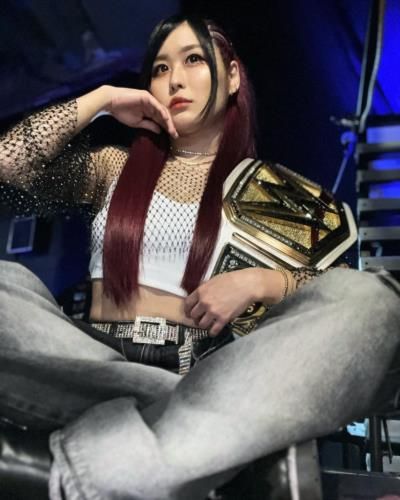 Iyo Sky Showcasing WWE Championship Belt In Proud Moment