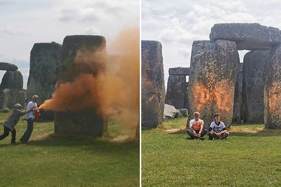 Stonehenge Spray-Painted Orange In Broad Daylight As Onlookers Try To Hold Back Vandals