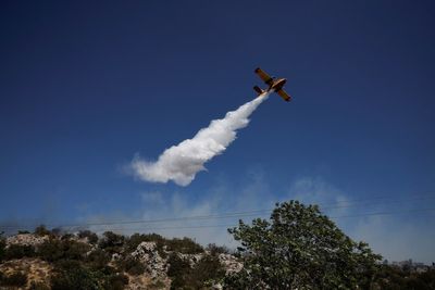 Huge blaze closes town near Athens as Greece prepares for wildfire season