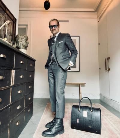 Bob Harper In Black Formal Suit With Stylish Bag Pose