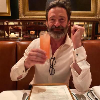 Hugh Jackman: Effortlessly Elegant Sipping A Refreshing Beverage