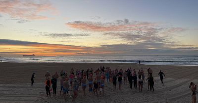 Sunrise ocean swimmers brave brisk waters on winter solstice