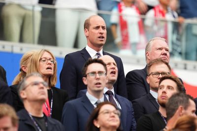 Prince William laughs with One Direction star and European king as he cheers on England team