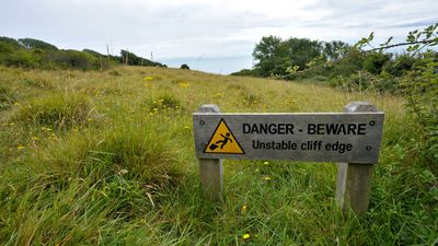 Camper pitches up on dangerously crumbling clifftop