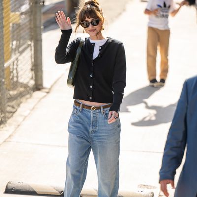 Dakota Johnson's Baggy Jeans and Slingback Heels Merge Femininity and Tom-Boy Vibes