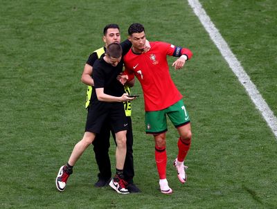 Cristiano Ronaldo mobbed by selfie-hunting pitch invaders in major Euro 2024 security breach