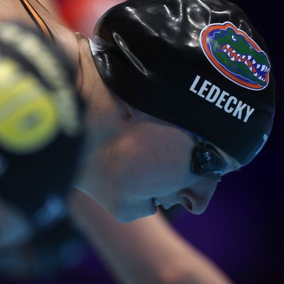 Olympian Kathleen Ledecky Balances a Glass of Chocolate Milk on Her Head While Swimming