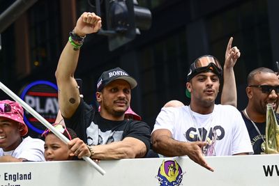 Joe Mazzulla jumping off the duck boats to high-five Boston Celtics fans