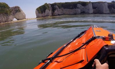 Boy survives after falling off Dorset clifftop while having photo taken