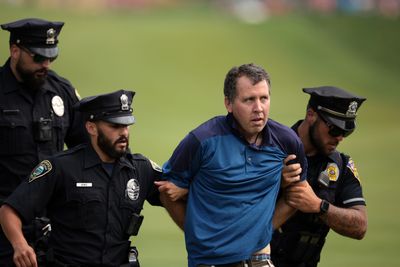 Watch: Protesters dragged off after storming 18th green at 2024 Travelers Championship as final group finishes