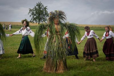 Thousands of Ukrainians mark pagan festival with bonfire jumping and air raid notifications